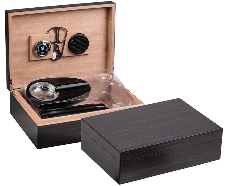 Two ebony wood humidors, one is open showing a humidifier, cigar scissors, ashtray, hygrometer and black leather cigar case.